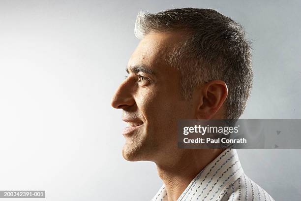 man smiling, side view - portrait profile stock pictures, royalty-free photos & images