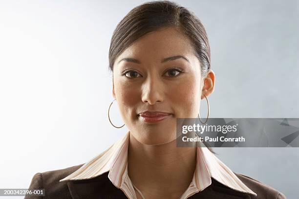 portrait of young businesswoman - hoop earring bildbanksfoton och bilder