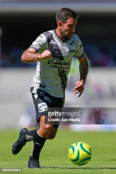 Pablo Gonzalez of Puebla drives the ball during the 6th round match between Pumas UNAM and Puebla as part of the Torneo Clausura 2024 Liga MX at...