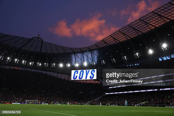 General view of sunset as the big screen shows 'Come on you Spurs' after their second goal went in during the Premier League match between Tottenham...