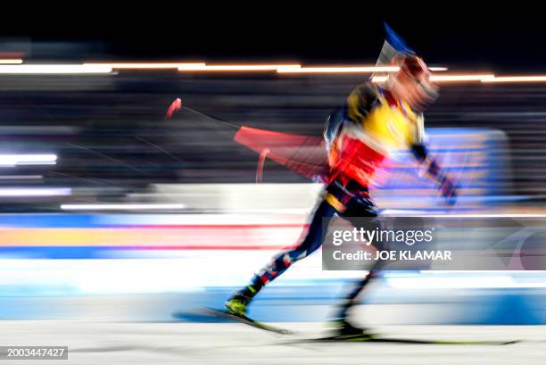 Norway's Johannes Thingnes Boe, overall leader and leader of the discipline, skis for his victory as he competes during the men's 20 km individual...