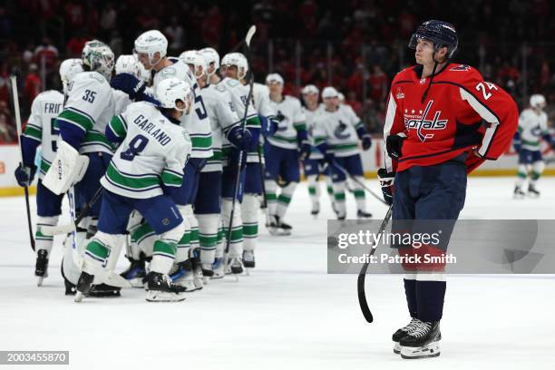 Connor McMichael of the Washington Capitals reacts after losing the Vancouver Canucks during overtime at Capital One Arena on February 11, 2024 in...