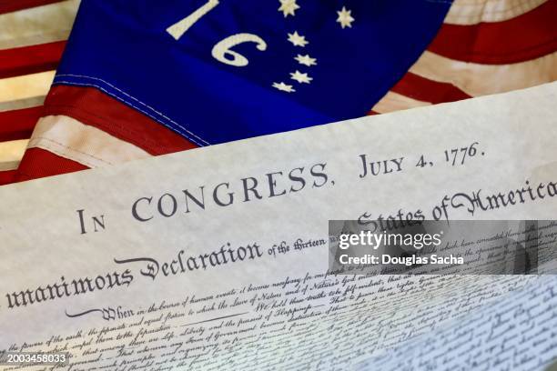 the declaration of independence historical document on an american flag - list of diplomatic missions in washington d.c. stock pictures, royalty-free photos & images