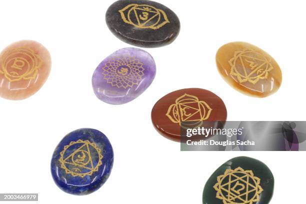 reiki healing crystals with chakra symbols for holistic balancing - wicca stock pictures, royalty-free photos & images