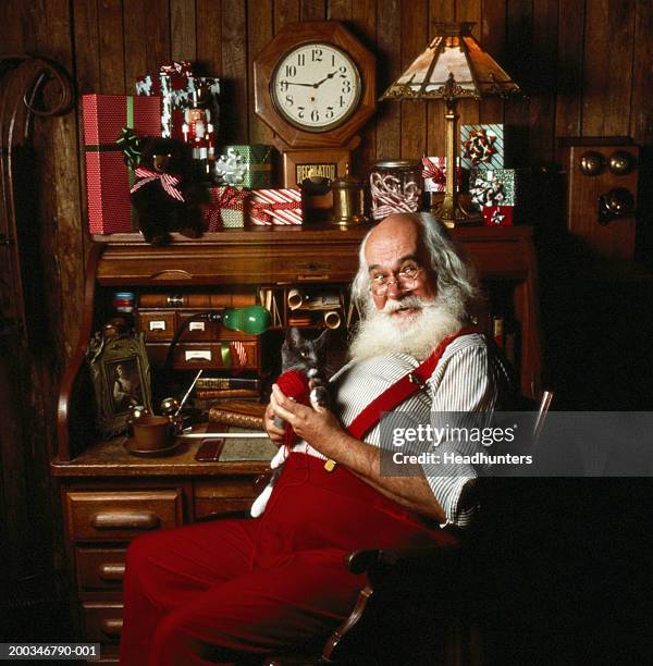mature man dressed as santa claus, portrait - santas workshop stock pictures, royalty-free photos & images