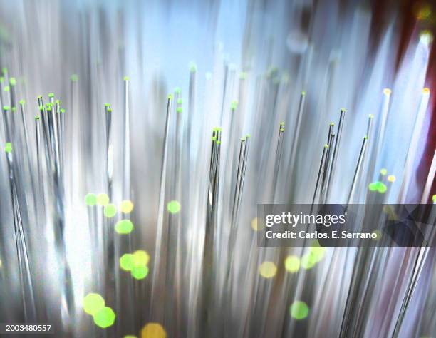 fiber optics illuminated tubes with light green tips with a soft defuse background - yonkers stock pictures, royalty-free photos & images