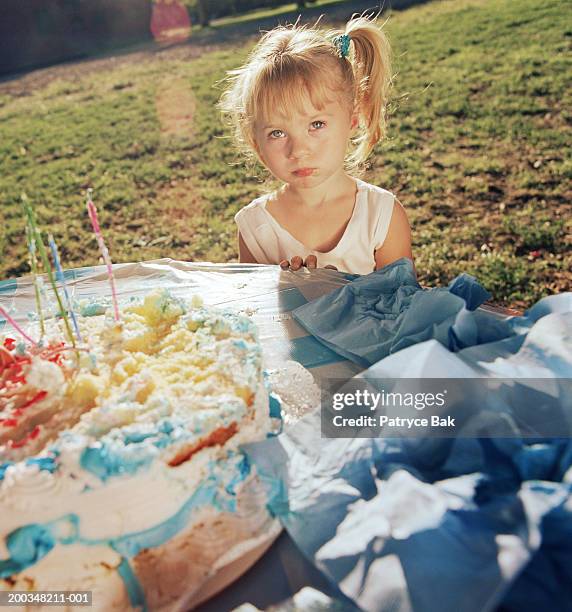 girl (4-6) at birthday party in park - sad birthday stock pictures, royalty-free photos & images