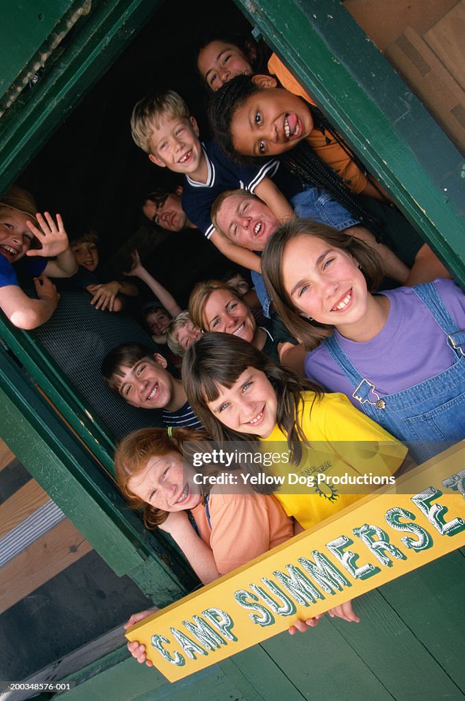Children (10-14) and counselors at summer camp, portrait