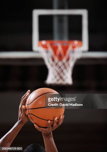 basketball player making free throw, rear view, close-up of hands - basketball close up ストックフォトと画像