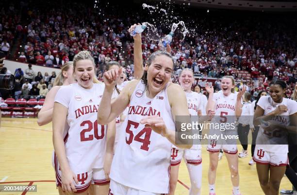Mackenzie Holmes of the Indiana Hoosiers celebrates with teammates after the 95-62 win against the Purdue Boilermakers at Simon Skjodt Assembly Hall...