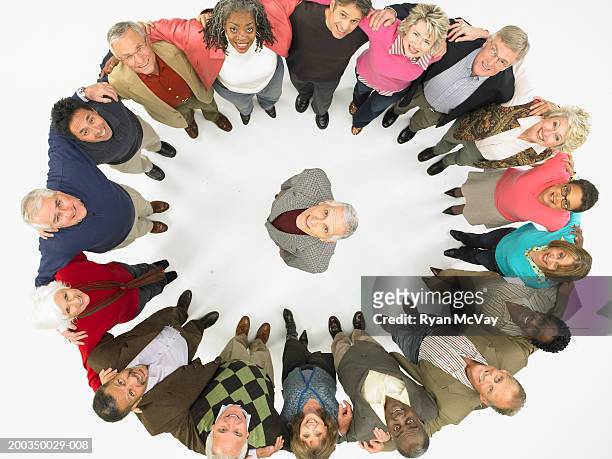 group of mature men and women in circle around man, looking up - looking around on white background stock pictures, royalty-free photos & images