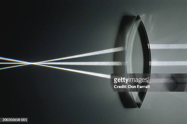 light rays refracted by convex lens, close-up - convex stock pictures, royalty-free photos & images