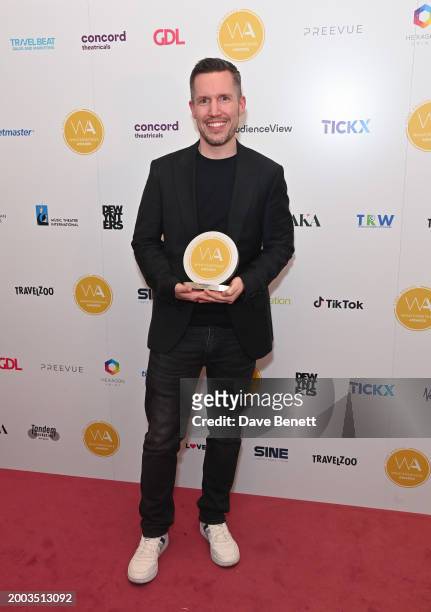 Adam Fisher poses in the Winners Room at The 24th Annual WhatsOnStage Awards 2024 at The London Palladium on February 11, 2024 in London, England.