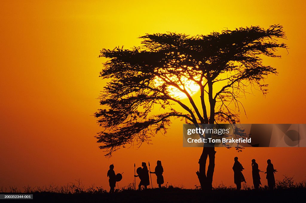 Masai tribe silhouetted at dawn, Kenya