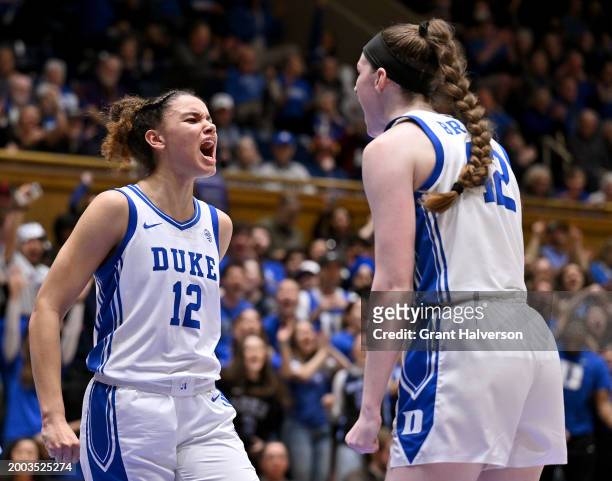 Delaney Thomas of the Duke Blue Devils reacts after scoring a basket and drawing a foul against the North Carolina Tar Heels during overtime of the...