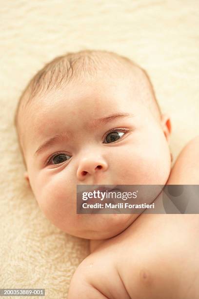 baby girl (3-6 months) lying on blanket, close-up - first exposure series stock pictures, royalty-free photos & images