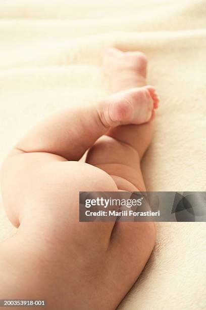 baby girl (3-6 months) lying on side, low section, close-up - bottom up ストックフォトと画像