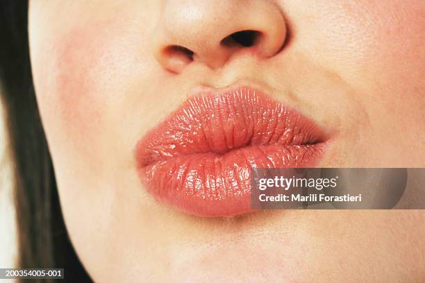 young woman puckering lips, close-up - female puckered lips stockfoto's en -beelden