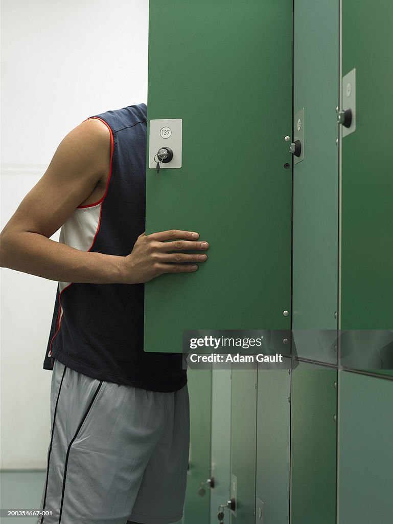 Man looking in locker