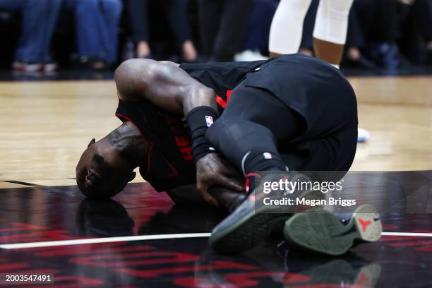 Terry Rozier of the Miami Heat reacts after suffering an apparent injury during the third quarter of the game against the Boston Celtics at Kaseya...