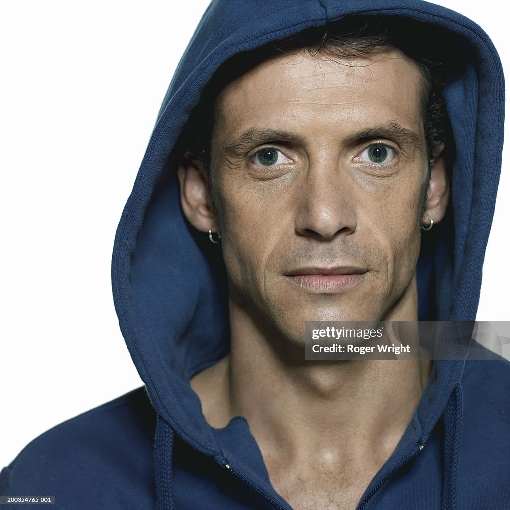 Man wearing hooded top, portrait, close-up