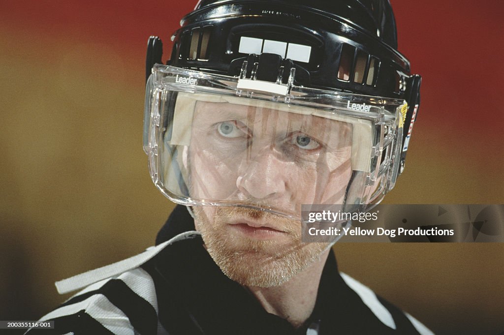 Hockey referee wearing helmet, close-up