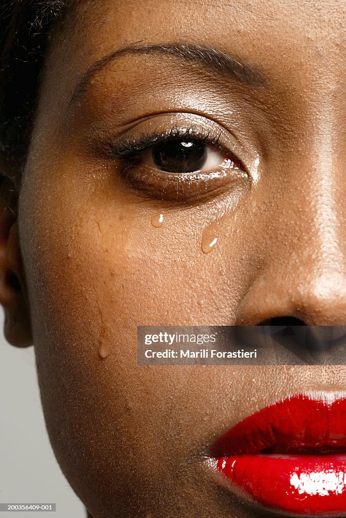 Young woman crying, portrait, close-up