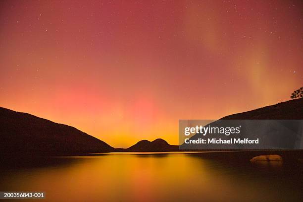 northern lights (aurora borealis) over pond - northern maine stock pictures, royalty-free photos & images