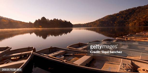 japan, nikko np, lake chuzenji, boats in foreground - präfektur tochigi stock-fotos und bilder
