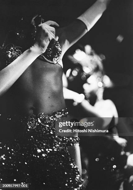 woman dancing, mid-section, low angle view (b&w) - cuba night stock pictures, royalty-free photos & images