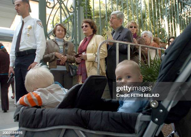 French citizens line up outside the French general consulate in Tunis to vote 22 April 2007. Some 44.5 million eligible voters are choosing a...