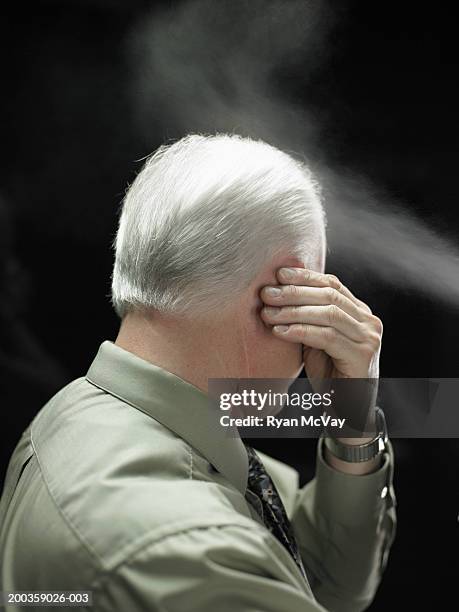 mature businessman using hairspray, side view - man rear view grey hair closeup stock pictures, royalty-free photos & images