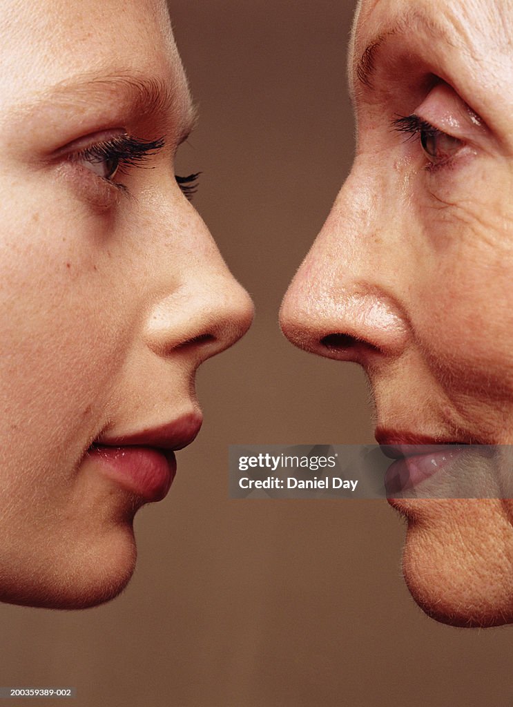 Senior woman and young woman, facing each other, profile, close-up