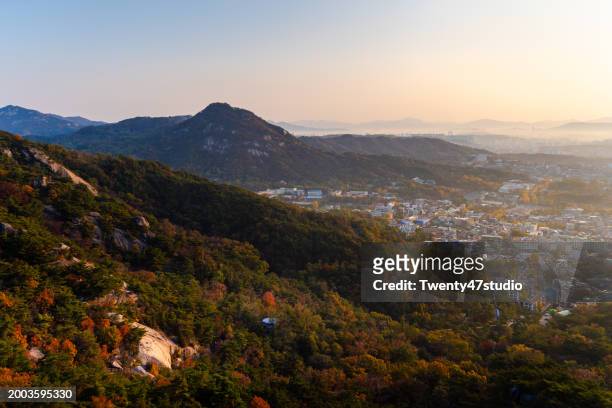 seoul city skyline view from inwangsan mountain in the morning - seoul south korea skyline stock pictures, royalty-free photos & images