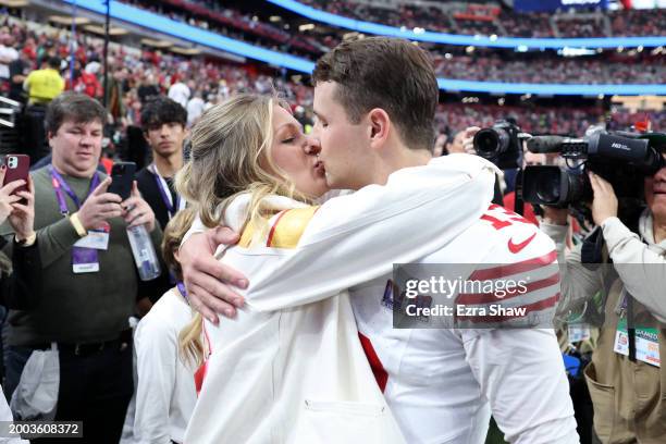 Brock Purdy of the San Francisco 49ers kisses fiancee Jenna Brandt before Super Bowl LVIII against the Kansas City Chiefs at Allegiant Stadium on...