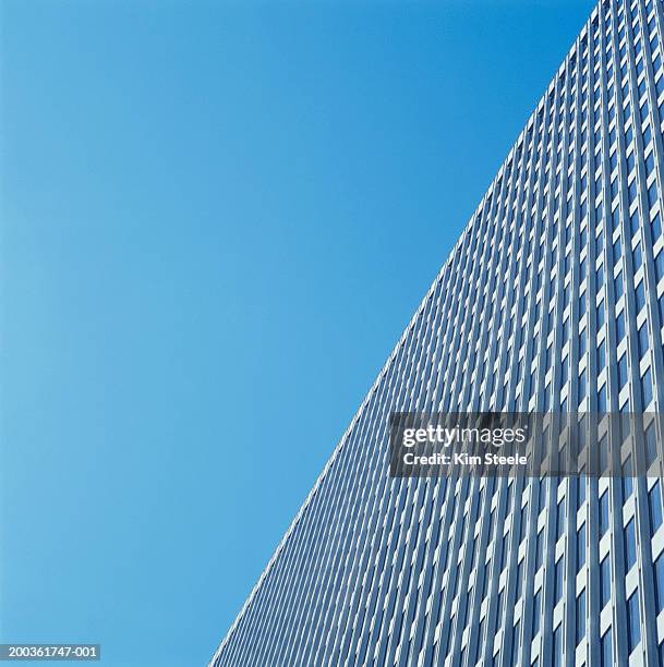 modern skyscraper against blue sky, low angle view - buildings side by side stock pictures, royalty-free photos & images