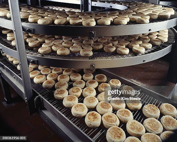 bakery producing english muffins, elevated view - staple ストックフォトと画像