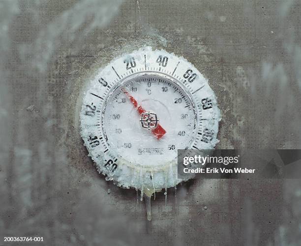 ice covered thermometer, close-up - freezing stock-fotos und bilder