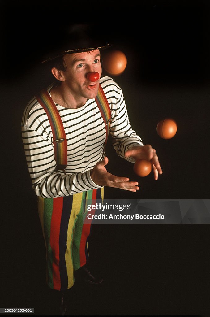 Clown juggling balls (blurred motion)