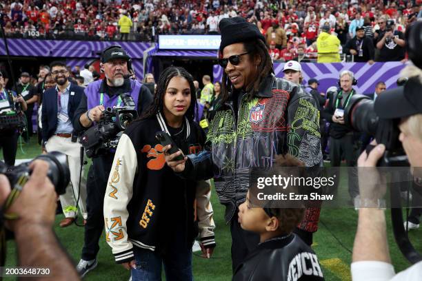 American Rapper Jay-Z stands on the sidelines with daughter Blue Ivy Carter before Super Bowl LVIII between the against the San Francisco 49ers and...