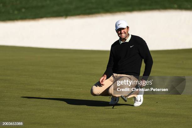 Scottie Scheffler of the United States reacts to his missed putt on the 12th green during the final round of the WM Phoenix Open at TPC Scottsdale on...