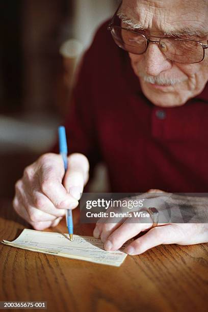 Man Write Check Adult Writing In A Cheque Book Photos and Premium High Res Pictures ...