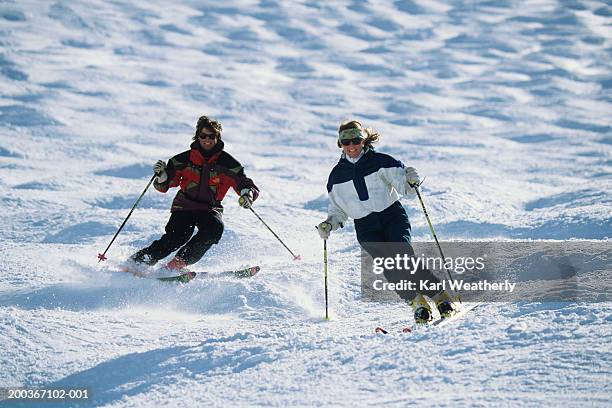two skiers in moguls, squaw valley, california, usa - mogul skiing stockfoto's en -beelden