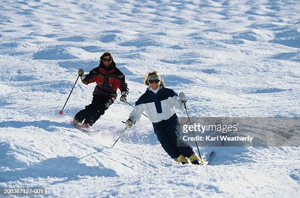 two skiers in moguls - mogul skiing stockfoto's en -beelden