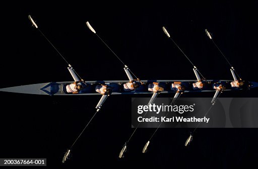 Overhead shot of woman's rowing team in practice Overhead shot of woman's rowing team in practice