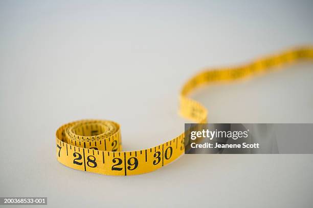 measuring tape, close up (soft focus) - tape measure stock pictures, royalty-free photos & images