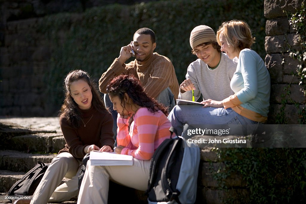 College students studying and using mobile phone