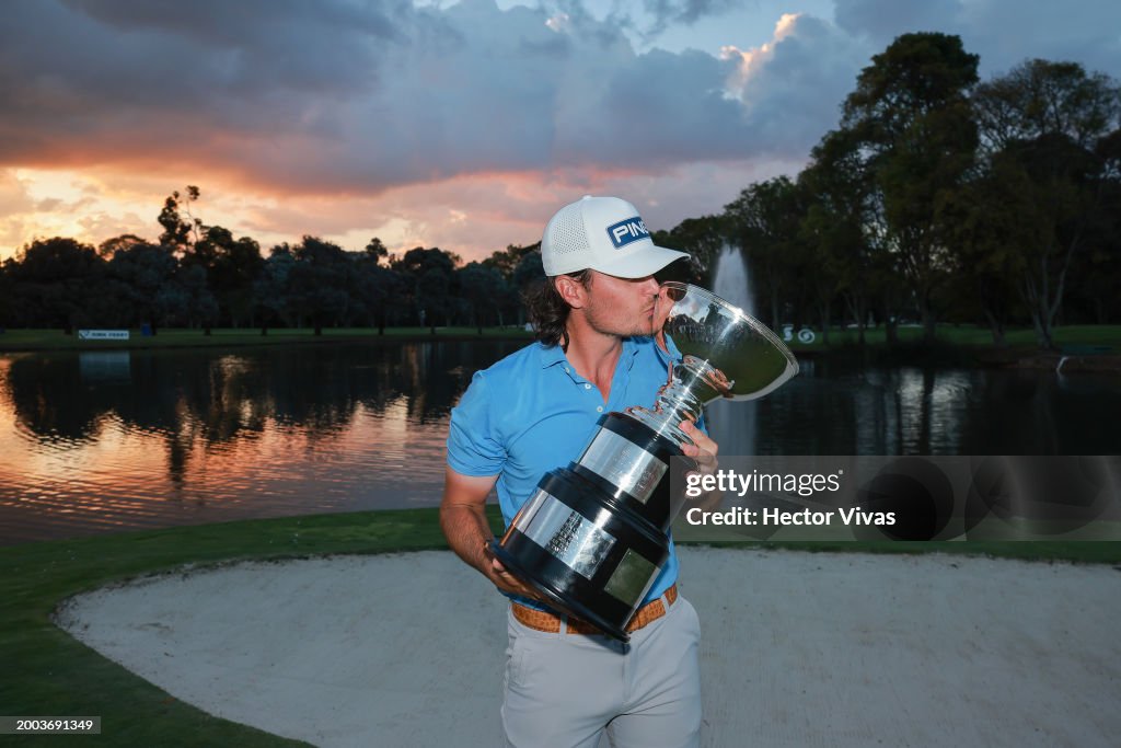 Kevin Velo of United States poses with the trophy after the final