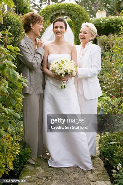 bride with mother and grandmother in garden - bride smiling stock pictures, royalty-free photos & images