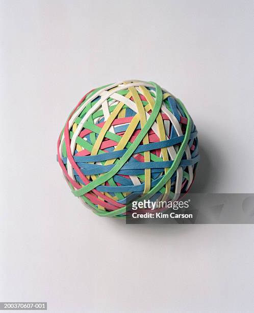 multicolored ball of rubber bands - elastic band ball stock pictures, royalty-free photos & images